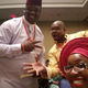 Faux Nigerian Jason Johnson, center, with actual Nigerians Obinna Nwokike, left, and Nkechi Nneji.